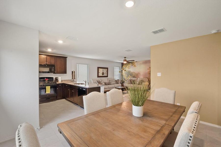 Dining space featuring recessed lighting, light tile patterned floors, and a ceiling fan