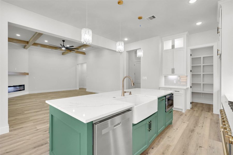 Stainless steel appliances and a sleek tile backsplash add a modern touch Stainless steel appliances and a sleek tile backsplash add a modern touch