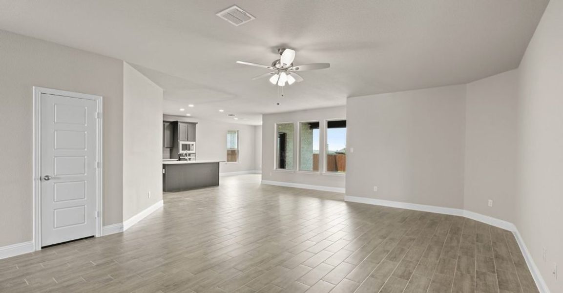 Representative exterior photo of a completed home built from the Donnington by Impression Homes in Still Water Lake, Godley, TX (Image 11).