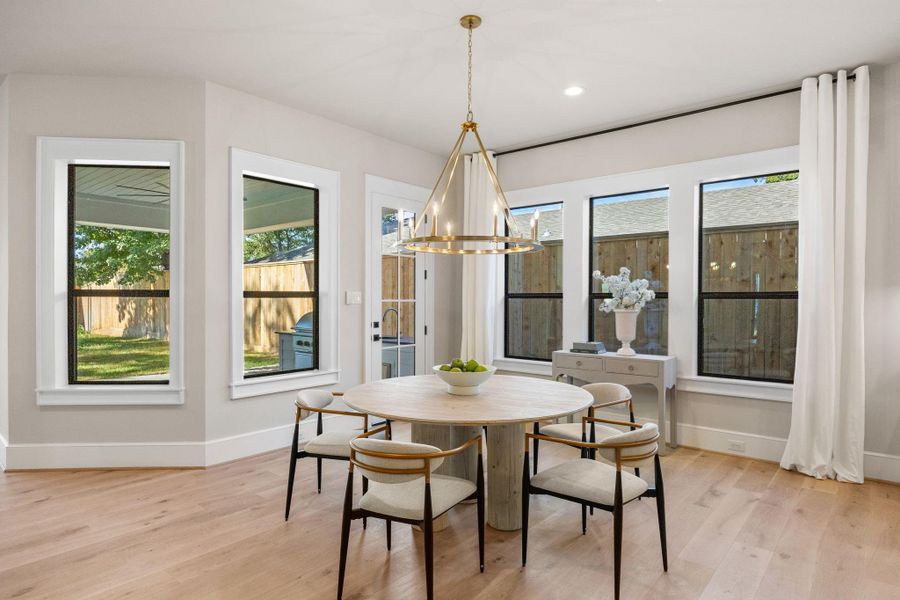 Breakfast Area offers abundant natural light & Designer selected chandelier.