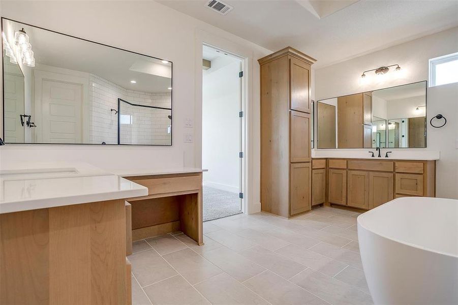 Bathroom with vanity, independent shower and bath, and tile patterned floors