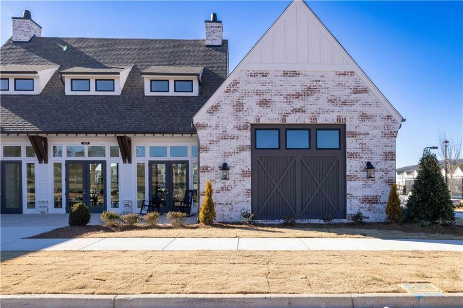 Front exterior of a new home in Promenade at Sawnee Village, Cumming, GA, highlighting curb appeal (Image 19).