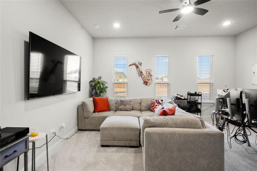 Carpeted living area featuring recessed lighting and ceiling fan Carpeted living area featuring recessed lighting and ceiling fan