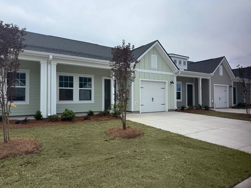 Front exterior of a new home in Blue Heron Retreat, Little River, SC, highlighting curb appeal (Image 2). Front exterior of a new home in Blue Heron Retreat, Little River, SC, highlighting curb appeal (Image 2).