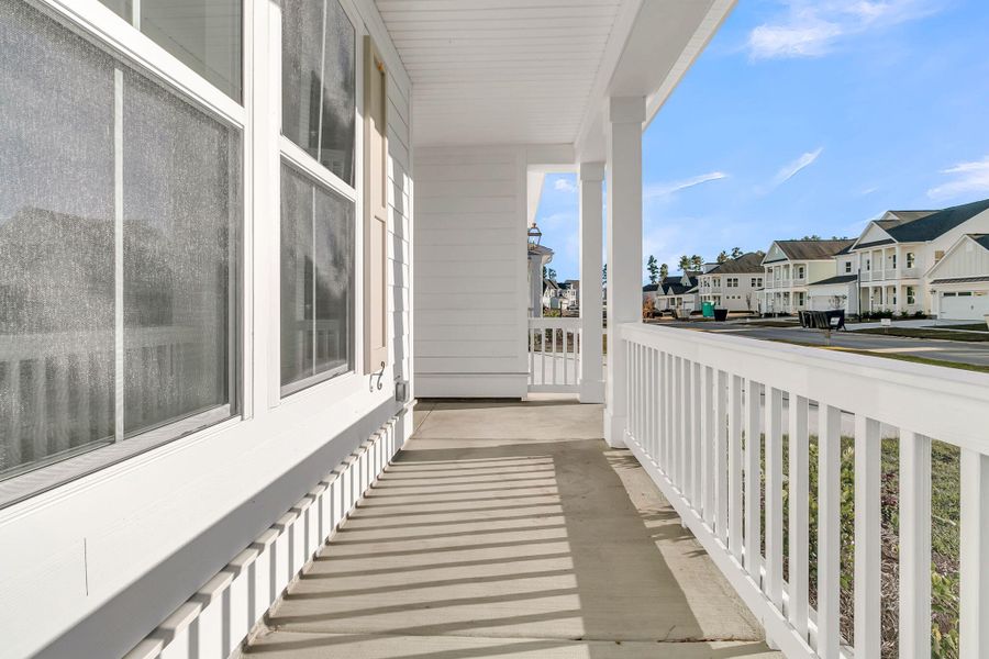 Exterior details and patio area of a home in Tidewater at Lakes of Cane Bay, Summerville (Image 26).