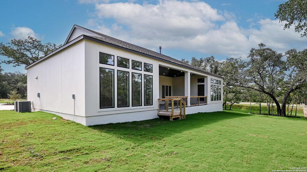 Front exterior of a new home in George's Ranch Acre, Boerne, TX, highlighting curb appeal (Image 22).