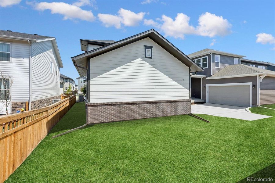 Exterior details and patio area of a home in Painted Prairie Cottage, Aurora (Image 4).
