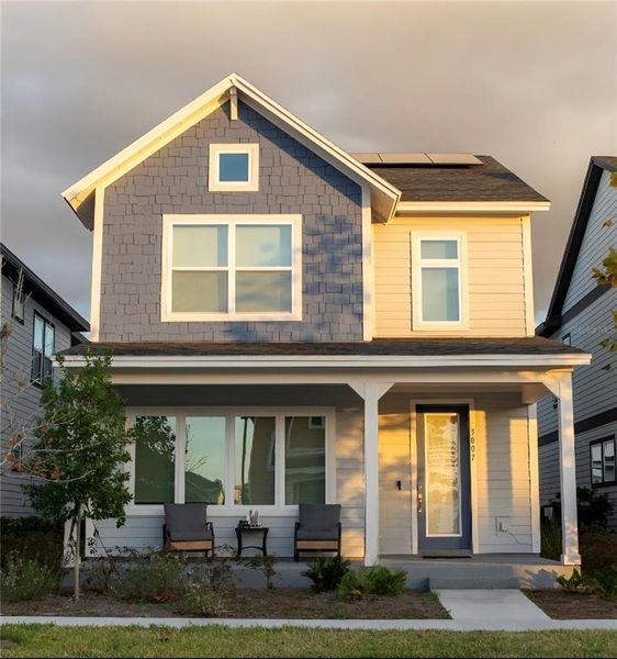 Front exterior of a new home in Weslyn Park in Sunbridge 34', St. Cloud, FL, highlighting curb appeal (Image 28).