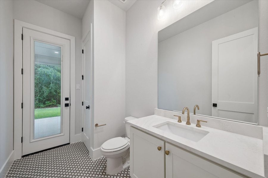 Powder Bath with back door leading to the Backyard - Perfect Pool Bath! The unedited photo showing the blinds down but open.