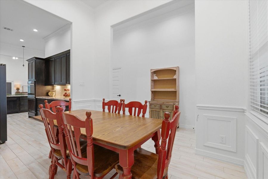 Formal dining room leading to kitchen