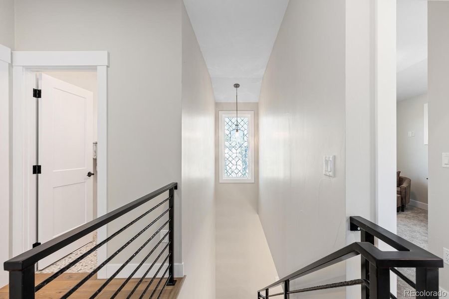 Beveled glass window detail with modern ironstair railing Beveled glass window detail with modern ironstair railing