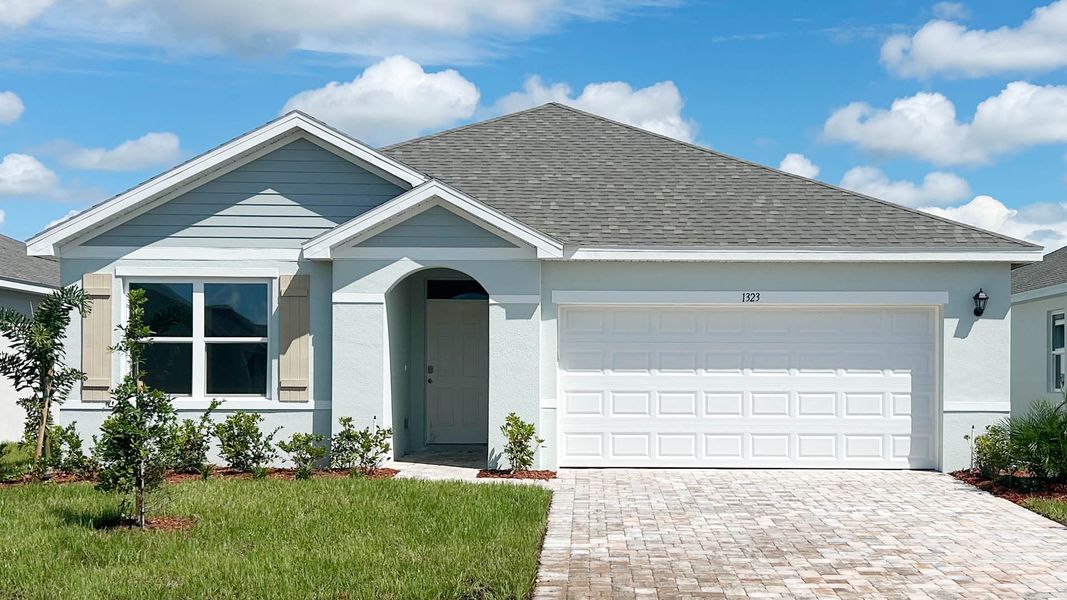Front exterior of a new home in Cypress Bay West, Palm Bay, FL, highlighting curb appeal (Image 1). Front exterior of a new home in Cypress Bay West, Palm Bay, FL, highlighting curb appeal (Image 1).