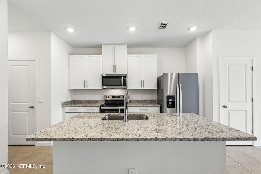 Furnished interior view inside a new home in The District at Oakleaf - The Commons, Middleburg (Image 6).