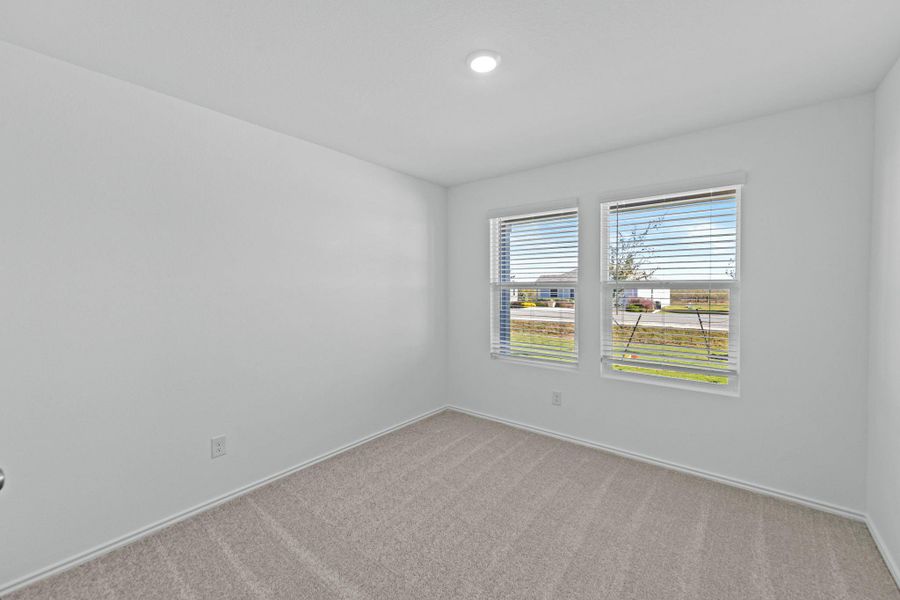 Empty room featuring carpet flooring Empty room featuring carpet flooring