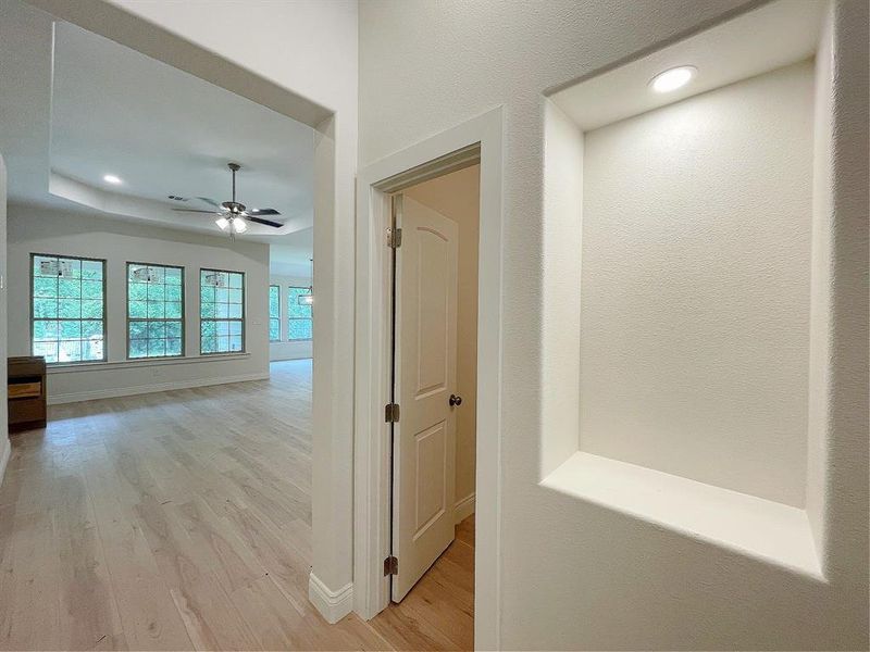 Thoughtful display nook right outside the half bath