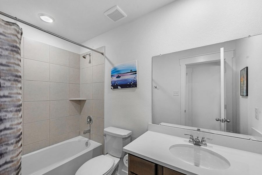 Secondary bathroom designed for comfort and convenience with updated finishes.