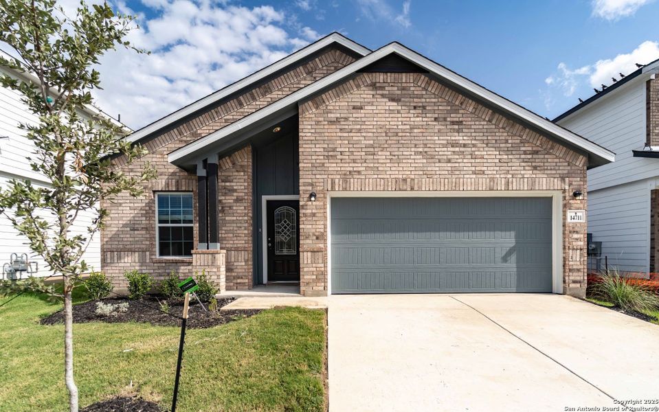 Front exterior of a new home in Hennersby Hollow, San Antonio, TX, highlighting curb appeal (Image 1). Front exterior of a new home in Hennersby Hollow, San Antonio, TX, highlighting curb appeal (Image 1).