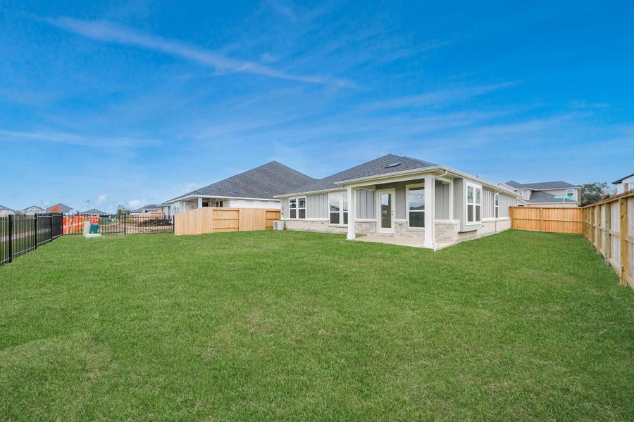 Exterior details and patio area of a home in Laurel Landing: Landmark Collection, Alvin (Image 24).