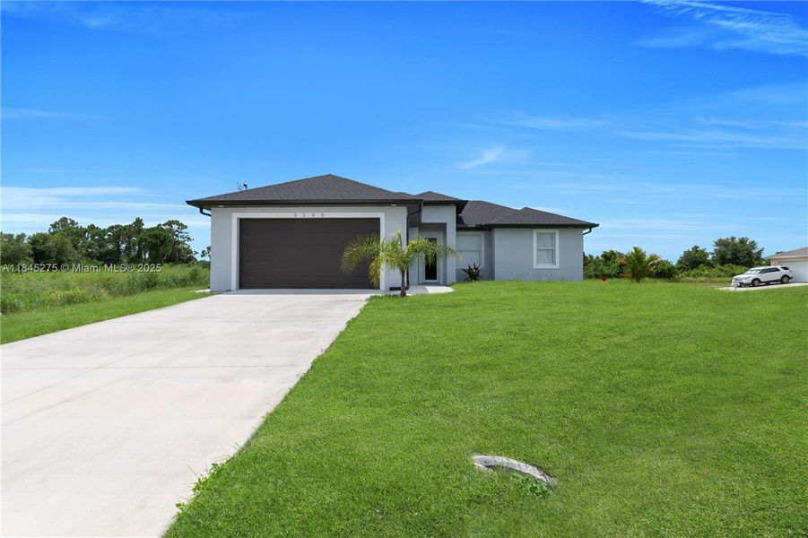 Front exterior of a new home in , Lehigh Acres, FL, highlighting curb appeal (Image 18).