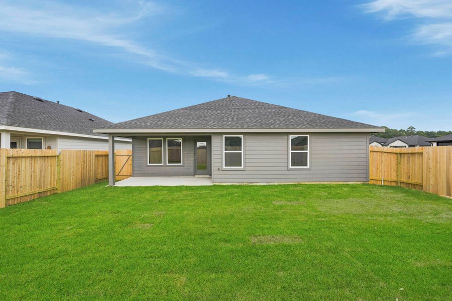 Exterior details and patio area of a home in Grand Pines, Magnolia (Image 3).