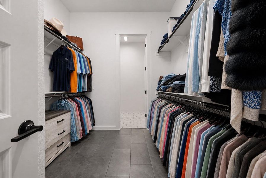 Ample hanging space and shelving create an organized wardrobe experience. Ample hanging space and shelving create an organized wardrobe experience.