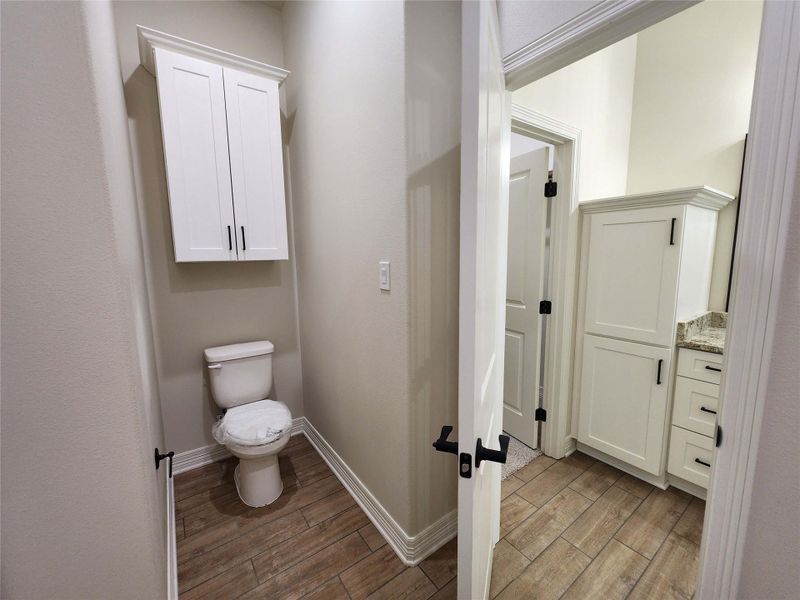 Bathroom with wood tiled floors and vanity