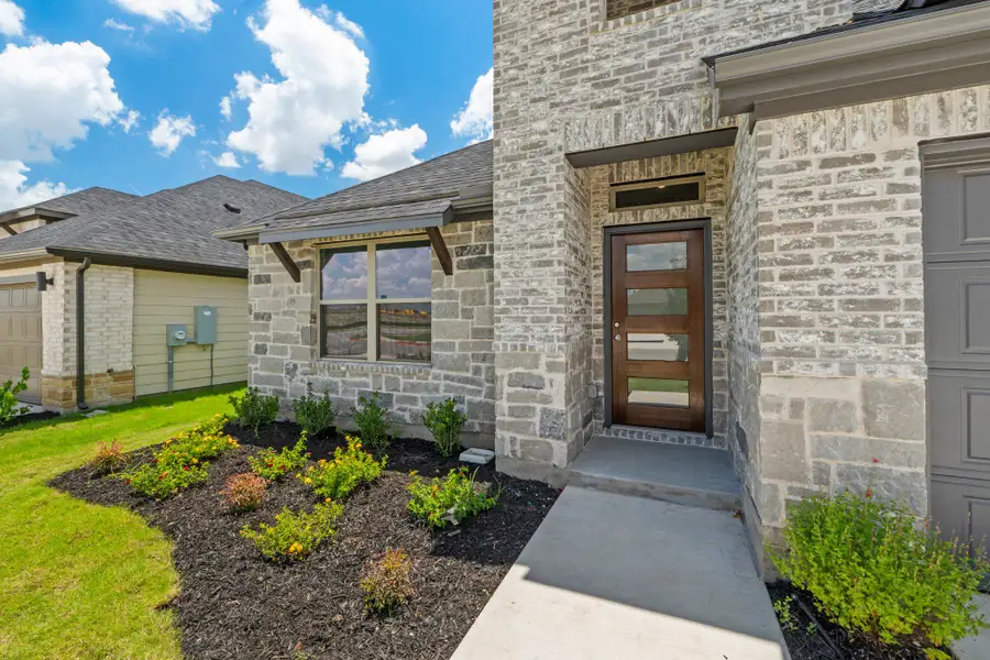 Exterior details and patio area of a home in Prairie Winds, Hutto (Image 3).