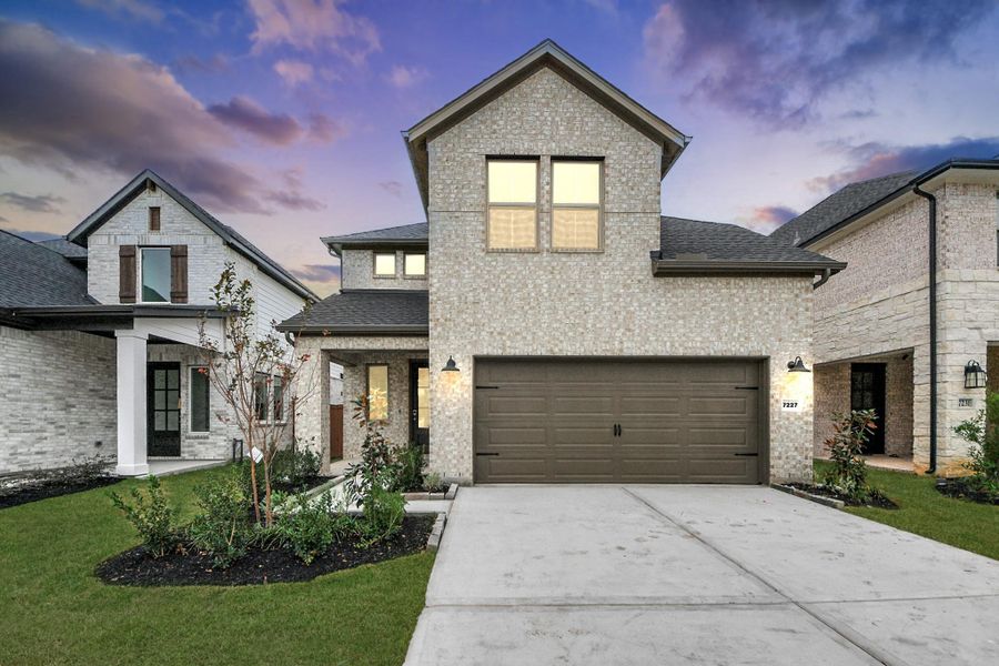 Front exterior of a new home in Elyson, Katy, TX, highlighting curb appeal (Image 23).