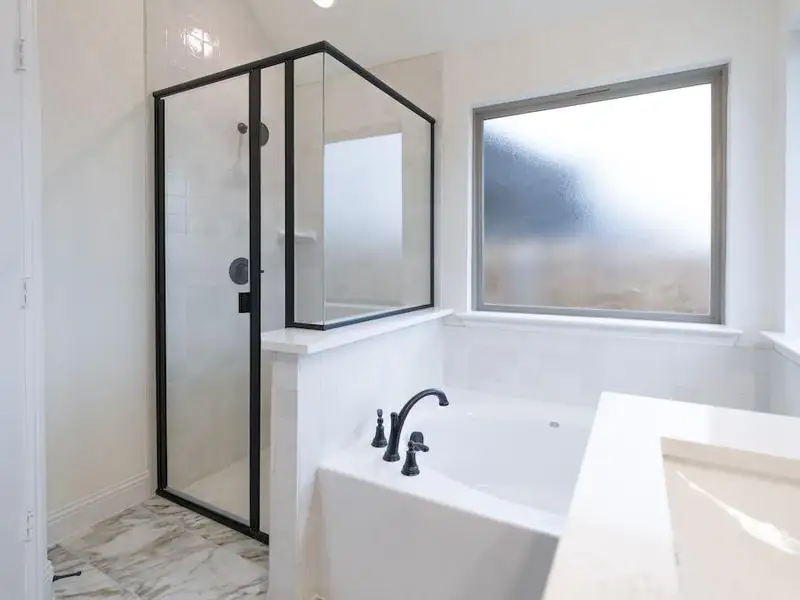 Bathroom featuring separate shower and tub