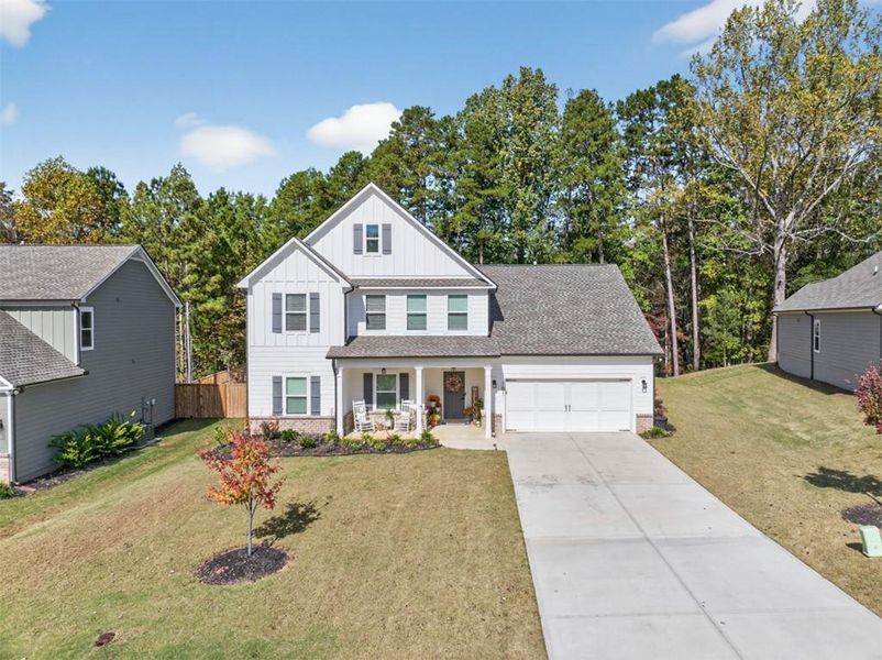 Front exterior of a new home in Calgary Downs, Winder, GA, highlighting curb appeal (Image 2). Front exterior of a new home in Calgary Downs, Winder, GA, highlighting curb appeal (Image 2).
