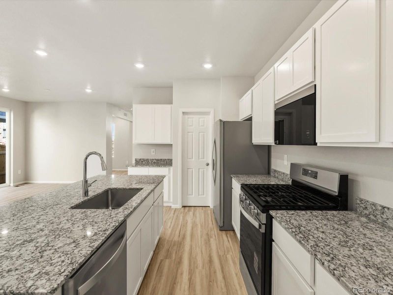 Furnished interior view inside a new home in Horizon Uptown: The Mountain Collection, Aurora (Image 12). Furnished interior view inside a new home in Horizon Uptown: The Mountain Collection, Aurora (Image 12).