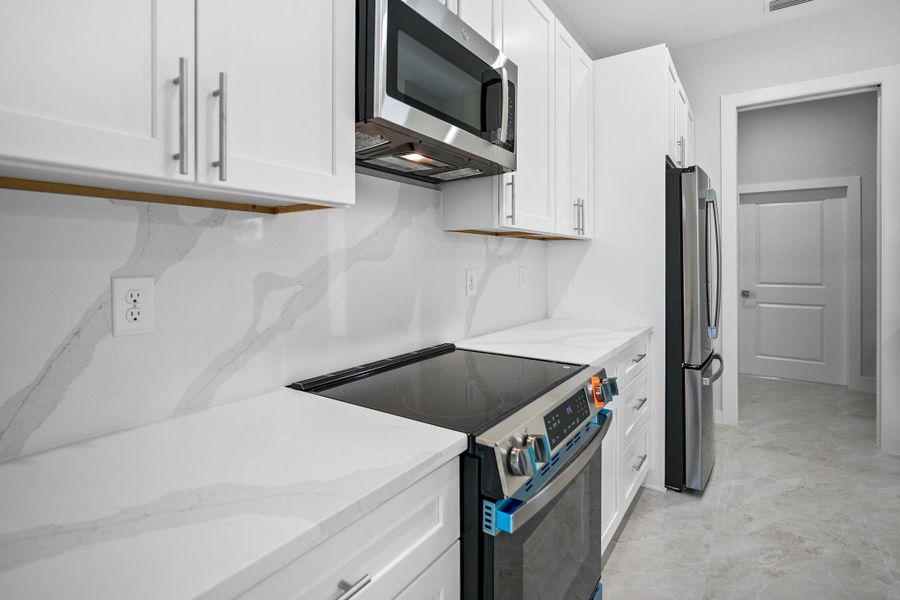 Furnished interior view inside a new home in , Port Charlotte (Image 11). Furnished interior view inside a new home in , Port Charlotte (Image 11).