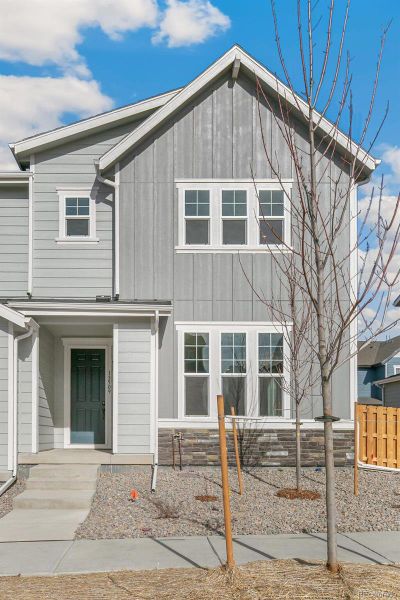 Front exterior of a new home in Turnberry Villas, Commerce City, CO, highlighting curb appeal (Image 24).