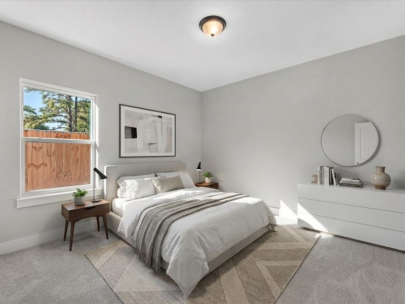 Comfortable secondary bedroom with natural light. Virtually staged Comfortable secondary bedroom with natural light. Virtually staged