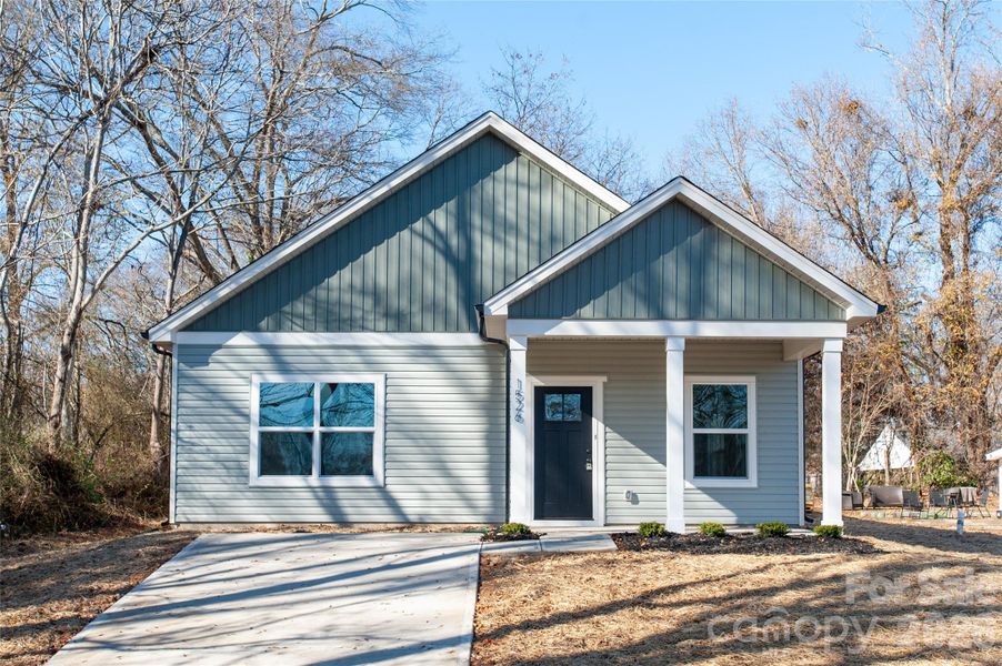 Front exterior of a new home in , Stanley, NC, highlighting curb appeal (Image 17).