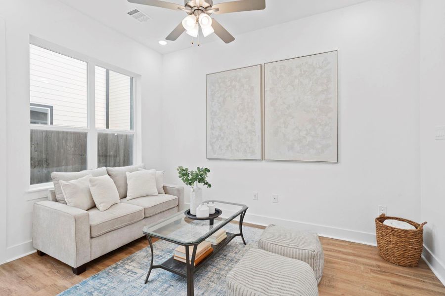 High ceilings and large windows create a bright, modern living area