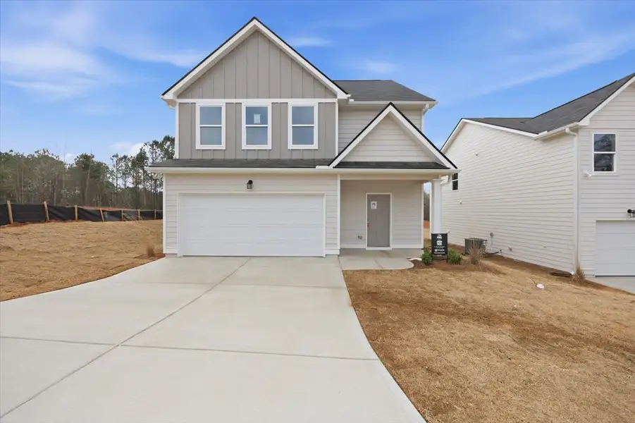 Front exterior of a new home in Creekside Manor, Thomaston, GA, highlighting curb appeal (Image 1). Front exterior of a new home in Creekside Manor, Thomaston, GA, highlighting curb appeal (Image 1).