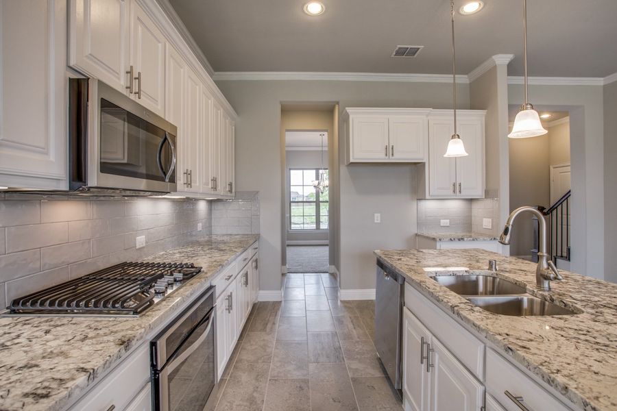 Representative furnished interior of a home built from the Burlington II by Megatel Homes in Santorini, Seagoville (Image 3).