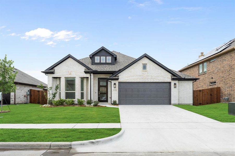 Front exterior of a new home in Ridge Ranch, Mesquite, TX, highlighting curb appeal (Image 19). Front exterior of a new home in Ridge Ranch, Mesquite, TX, highlighting curb appeal (Image 19).