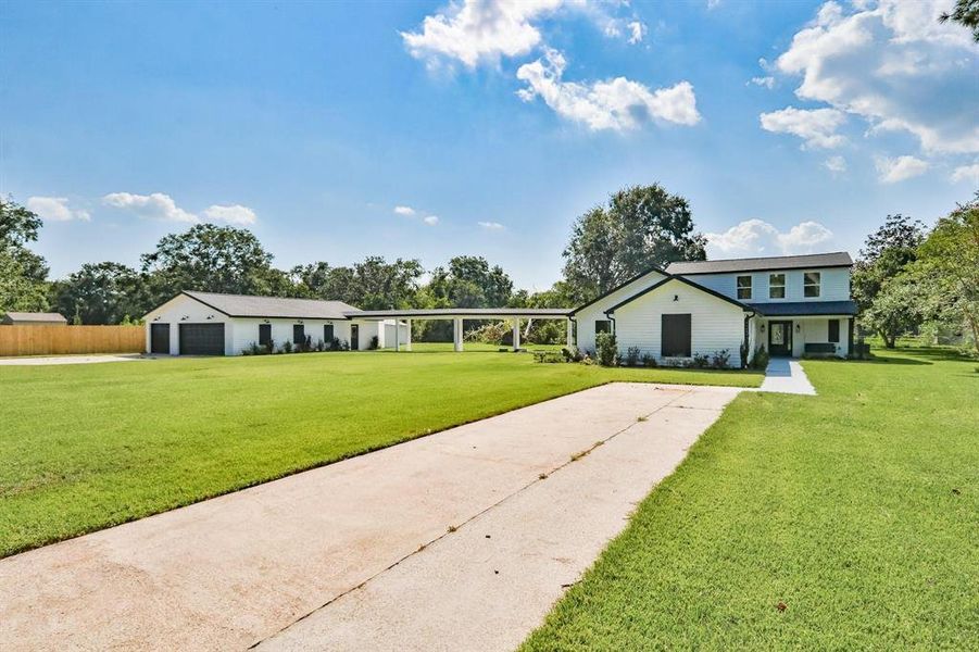 Brilliantly Flexible – Indoors And Out. Full French drains run from flowerbeds to end of driveway for great drainage. New Windstorm rated garage overhead doors.