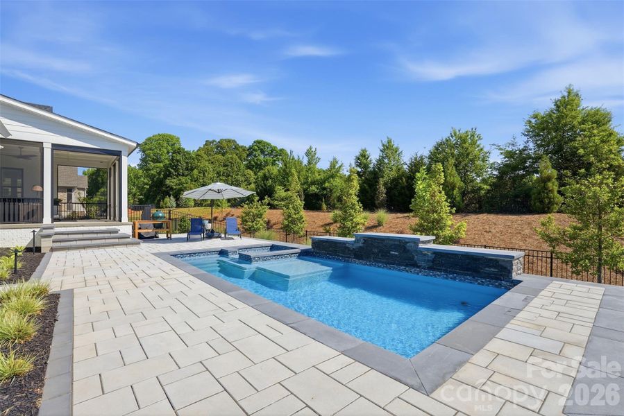 Pool with hot tub and fountain