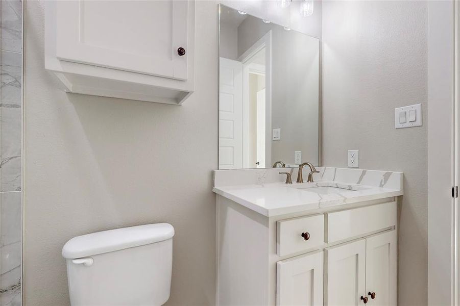 Bathroom with vanity and toilet