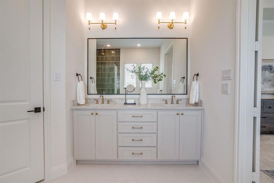 Primary bathroom with a separate shower, double vanity, level 4 Quartz countertops, and a garden tub. Primary bathroom with a separate shower, double vanity, level 4 Quartz countertops, and a garden tub.