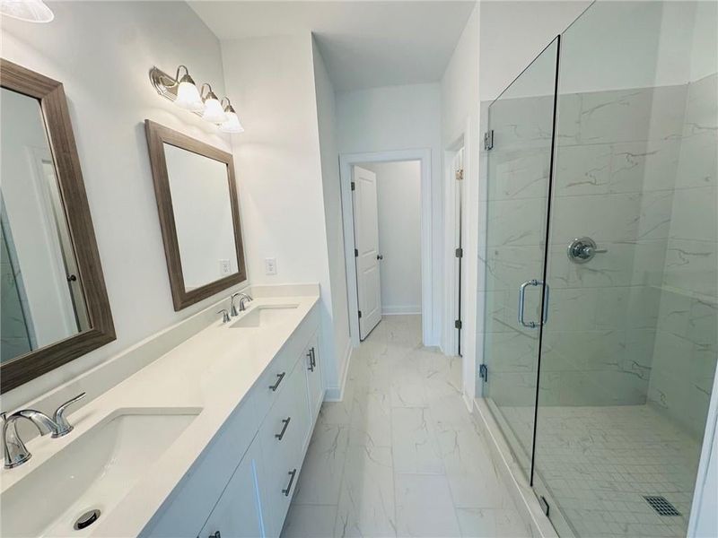 Huge spa like shower and walk in linen closet!