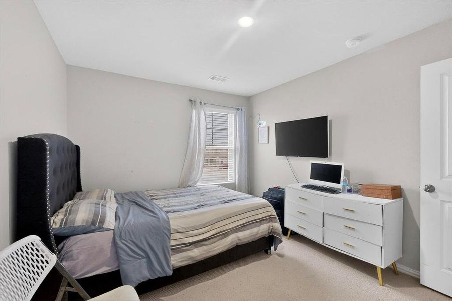 Bedroom with carpet flooring Bedroom with carpet flooring