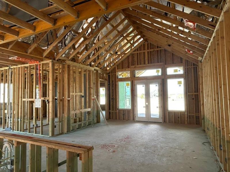 Misc room with a towering ceiling and french doors