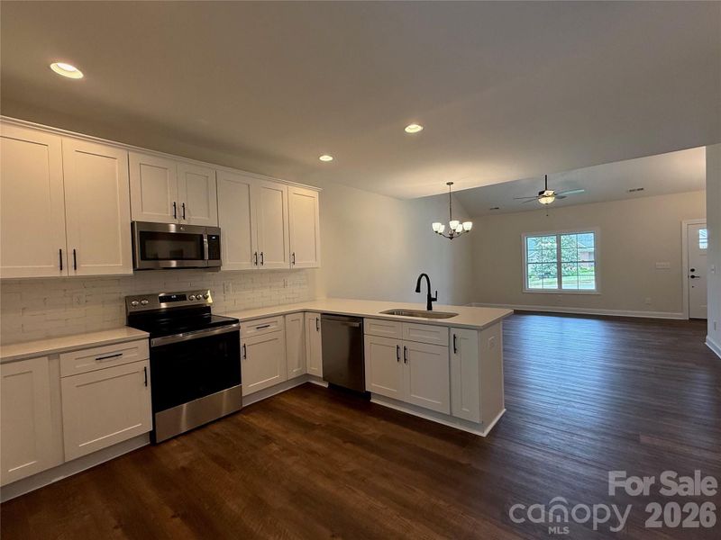 ...high end cabinetry, stainless steel appliances,...