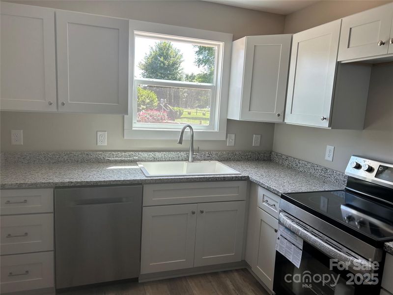 Granite countertops, soft closed drawers.