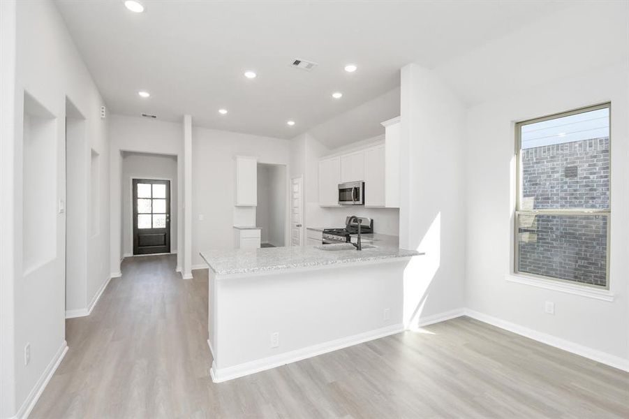 This generously spacious kitchen is a dream realized!