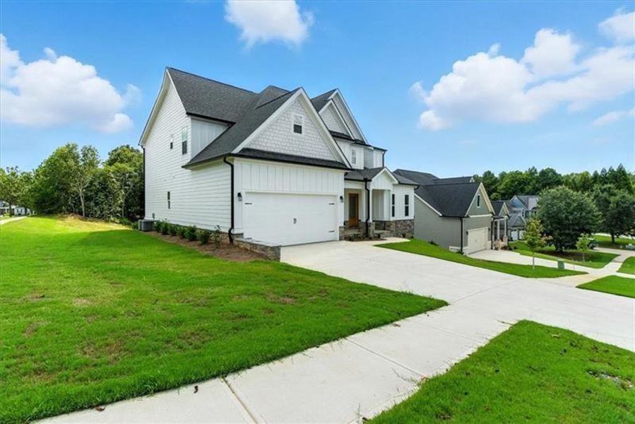 Front exterior of a new home in , Rome, GA, highlighting curb appeal (Image 26).